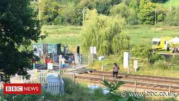 Level crossing warning after people took photos on track