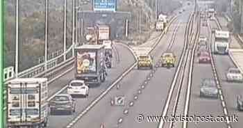 Crash on M4 - carriageway blocked by overturned caravan