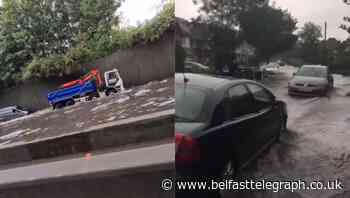 Vehicles stranded on M25 amid flash flooding