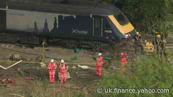 Police and Network Rail at scene of derailment