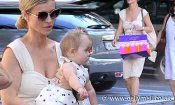 Joanna Krupa looks every inch the doting mom as she steps out with her  nine-month-old daughter