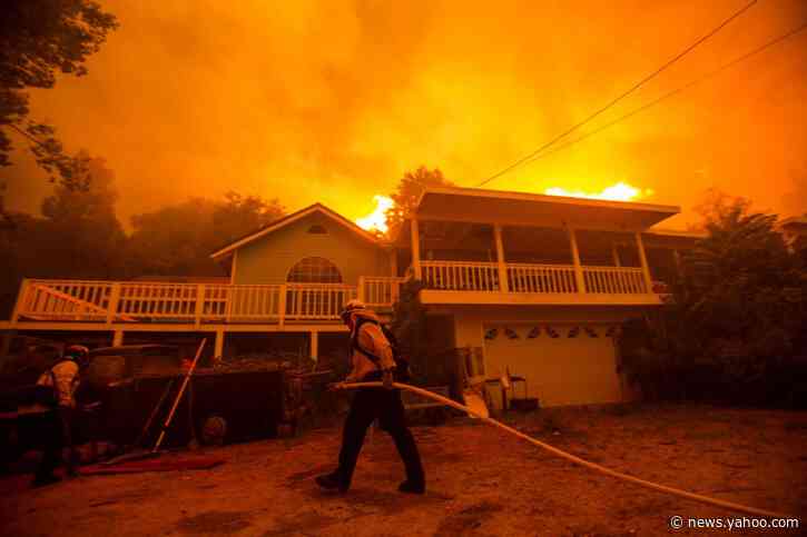 Crews try to tame California wildfire as heat wave arrives