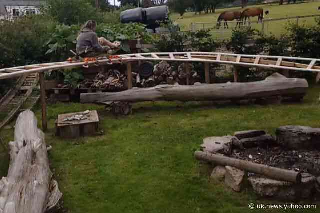 Uncle makes nephew&#39;s dream come true when he builds roller coaster in the back garden - using scrap metal, wood and plastic pipes