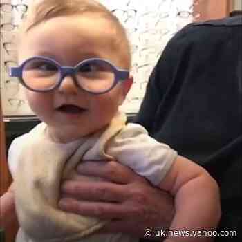 Overjoyed baby has huge smile after corrective glasses allow him to see for the first time