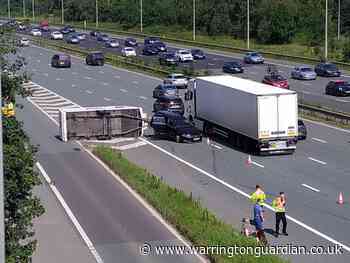 Caravan overturns on M6 slip road at junction 21 for Woolston