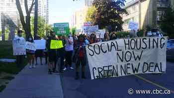 Groups demonstrate on same city street to express opposing views on midtown shelters