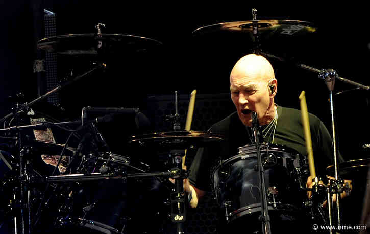 Chris Slade says he still believes that he is AC/DC’s drummer