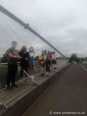 Campaigners scatter 20,000 petals in River Ouse