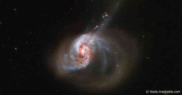 Two galaxies collide in this majestic Hubble image
