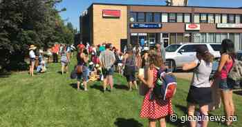 Dozens protest Alberta’s back-to-school plan outside education minister’s Red Deer office