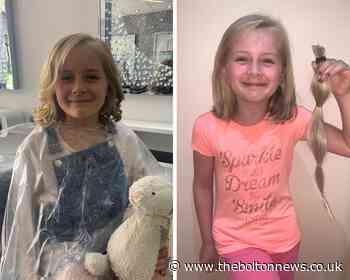 Charity champion! Eight-year-old girl donates her hair to cancer charity