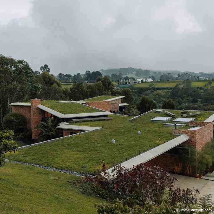 Casa Carmen's green roofs merge with hill and forest in Colombian neighbourhood