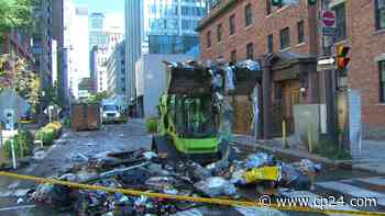 Truck dumps load of burning garbage onto downtown Toronto street after fire breaks out - CP24 Toronto's Breaking News