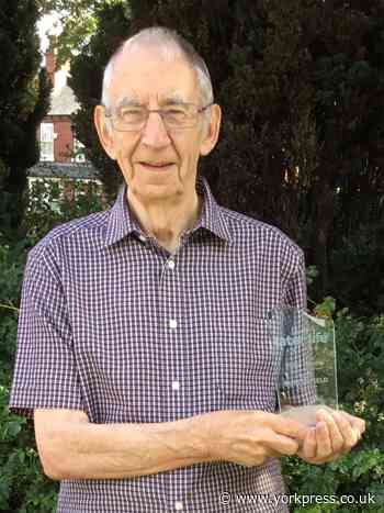 Retiree receives award for helping older neighbours use technology to keep in touch with loved ones