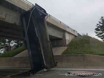 Driver suffers minor injuries after dump truck strikes Queensway overpass