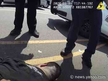 Body cam footage shows Phoenix police restraining a man on asphalt in 100-degree heat who later died