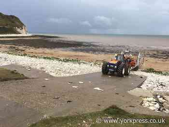Three rescued by RNLI after getting cut off by tide