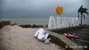 Marco strengthens to hurricane, joins tropical storm Laura on path to U.S. Gulf Coast
