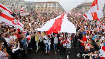 Video shows armed Belarus president as capital sees massive protests over election
