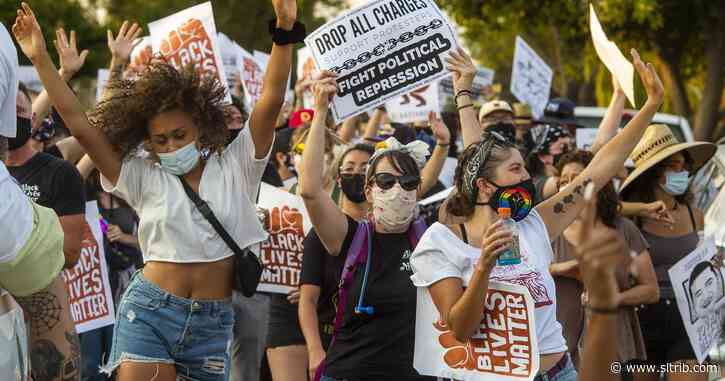 Protesters dance in Rose Park