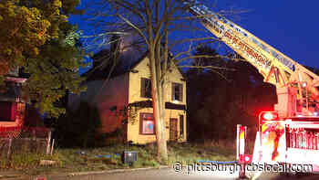 Firefighters Work To Keep Abandoned House Fire From Spreading