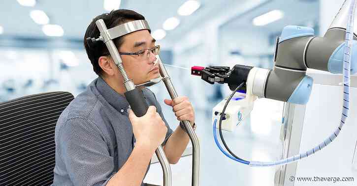 Please remain calm while the robot swabs your nose