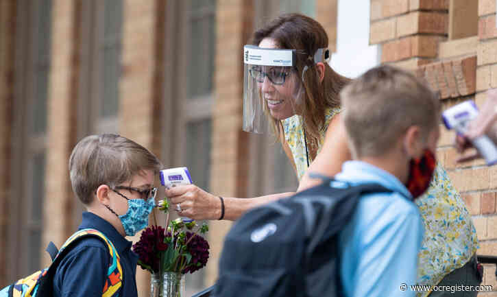 Masks, temperature checks, pictures mark first day in person at St. John’s Lutheran School in Orange