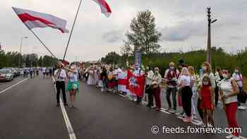Lithuania citizens form human chain to support Belarus protests, with fourth protester found dead