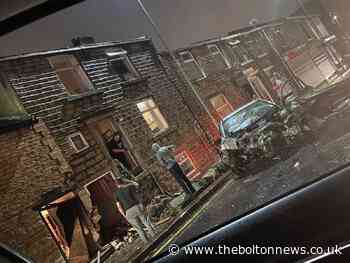 Shocking moment car ploughs into homes on Blackburn street