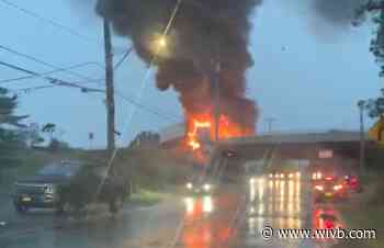 Driver taken to hospital as tractor-trailer on fire hangs off overpass of 190 W