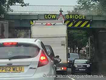 Lorry crashes into railway bridge over Orford Road