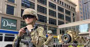 Downtown Minneapolis cleans up after night of looting; National Guard arrives