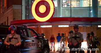 Show of force, dozens of arrests mark quiet night in rattled Minneapolis