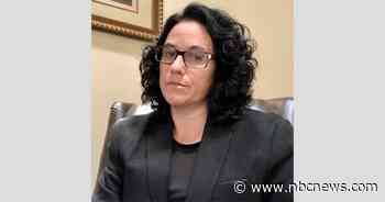 Educator survived COVID-19, only to face being fired, she says