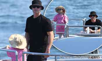 Michael Clarke dotes on daughter Kelsey Lee, four, as they enjoy a day on Anthony Bell's superyacht