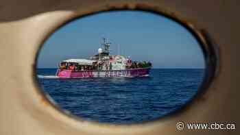 Banksy's migrant rescue boat overloaded, stranded at sea, rescuers say