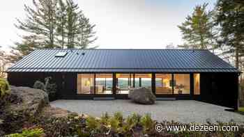 Desai Chia Architecture perches blackened Ledge House on rocky hillside - Dezeen