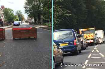 Planters block streets to stop through traffic from The Groves