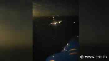 Alaska villagers use vehicles to light runway for medevac carrying child