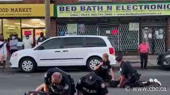 SIU investigating after altercation at Toronto demonstration leaves 7 officers injured, 2 people arrested - CBC.ca