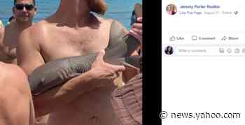 A shark latched onto a Florida man’s arm and decided to stay awhile, video shows