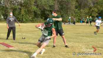 Current Huskies football players help coach high school athletes at elite camp