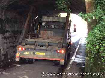 Lorry gets stuck under bridge in Lymm