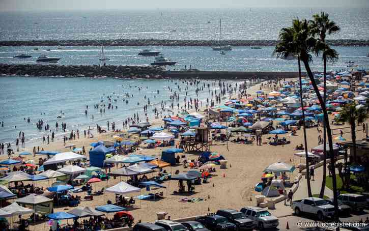 Photos: Beach crowds seek relief from heat along the coast