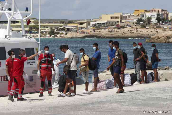 Migrants are moved from overcrowded Italian island facility