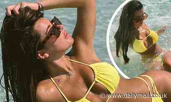 Brielle Biermann sizzles in a yellow bikini at the beach before putting on a mirror fashion show
