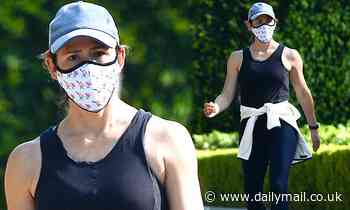 Jennifer Garner shows off her toned figure in black leggings as she enjoys a brisk walk around LA
