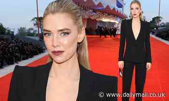Vanessa Kirby commands attention in a plunging black suit at Venice Film Festival