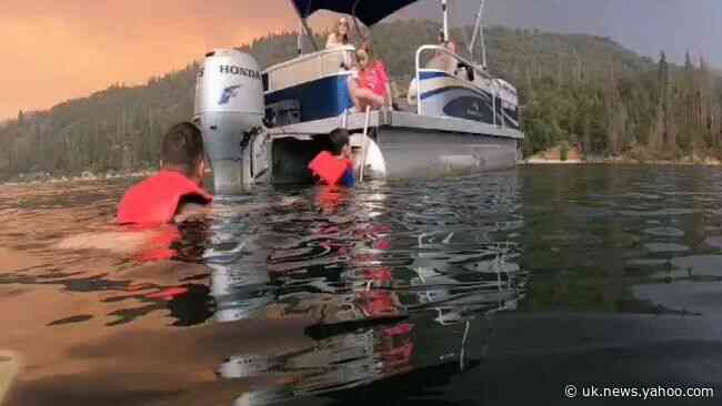 Visitors Evacuate as Creek Fire Smoke Looms Over California's Bass Lake