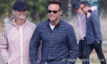 Ant McPartlin and girlfriend Anne-Marie Corbett share a giggle while out walking their dogs